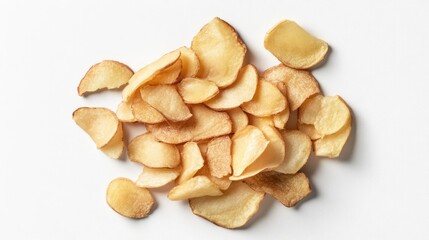 Crispy golden fried potato chips scattered on a white background for snack and food photography concepts