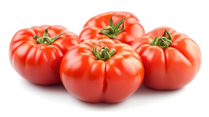 Fresh organic heirloom tomatoes arranged artistically on a clean white background showcasing their vibrant red color and unique shapes.
