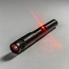 A small handheld laser pointer with a sleek design © ahmad