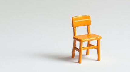 Miniature orange school chair on white background symbolizing education and childhood creativity