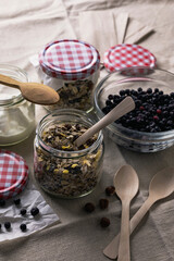 Oatmeal for healthy breakfast in glass jar with yogurt and blackberries, breakfast to go concept