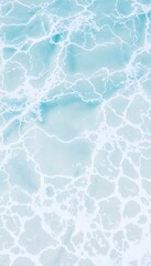 Obraz premium A close-up shot of ocean waves, showcasing the beautiful blue water and white foam. Perfect for backgrounds, textures, and marine-themed designs.