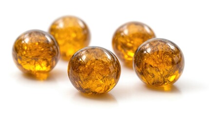 Golden yellow serum bubbles isolated on white background showcasing luxury skincare product with glossy texture and vibrant color.