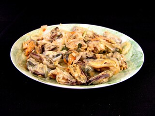 Seafood dishes on white plates