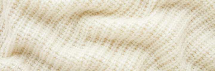 White striped wavy soft knitted fabric background. Closeup. Wide banner. Top down view.