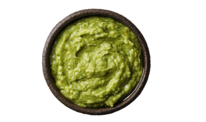 Bowl with guacamole isolated on white background, top view