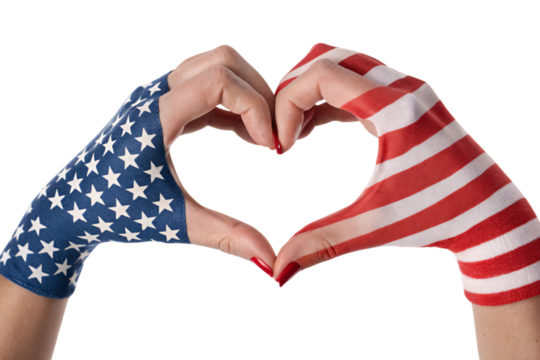 Close-up of hands forming a heart, showcasing red nails and American flag patterns, celebrating love for the United States, set against a transparent background