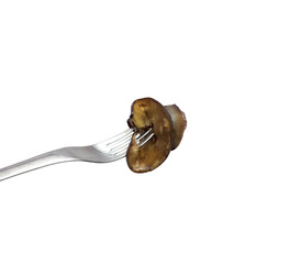 Fork holding a grilled mushroom slice on transparent background