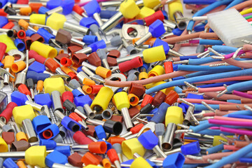 Copper pin colored insulated tips. Close-up. Soft focus.