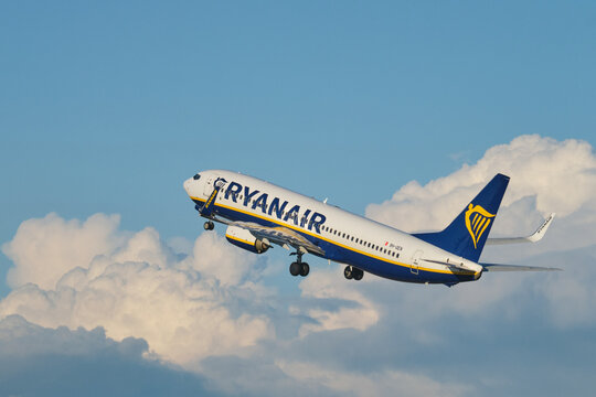 Lisbon, Portugal - September 2, 2023: Ryanair Boeing 737-8AS passenger plane after take off in Humberto Delgado Airport in Lisbon in sky with clouds