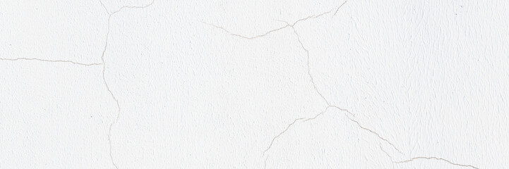 Old wall with cracked plaster. Weathered rough surface. Vintage texture is perfect for background and design.