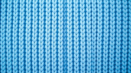 Close-up view of a textured knitted fabric with a light blue color palette, showing intricate stitch detail