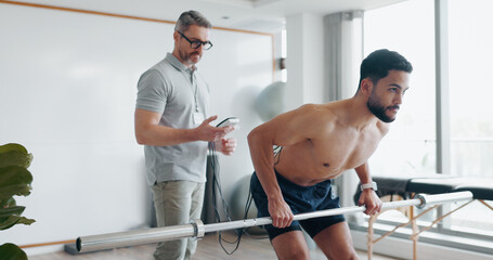 Physiotherapy, weightlifting and monitor with man in clinic for biofeedback, muscle results and...