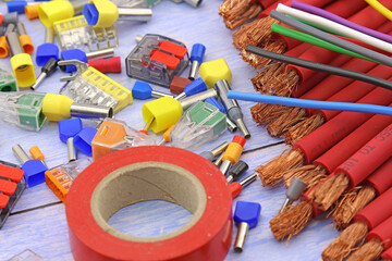 A roll of colored insulating tape. On a dark background.