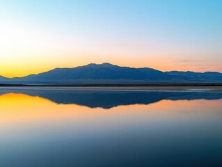 Fototapeta premium serene mountain reflection at sunset over calm water