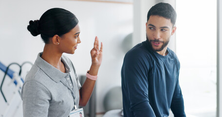 Okay, physiotherapy and healthcare with people in clinic for consulting, muscle recovery and treatment success. Support, medical and thank you with woman and man for performance coach and approval