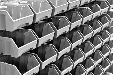 Rack with plastic trays for storing small parts