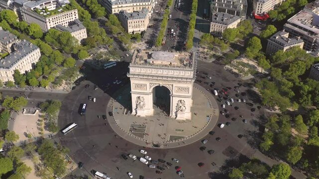 PARIS, FRANCE - OCTOBER 3, 2024: Aerial view of the Arc de Triomphe with bustling traffic in the heart of Paris