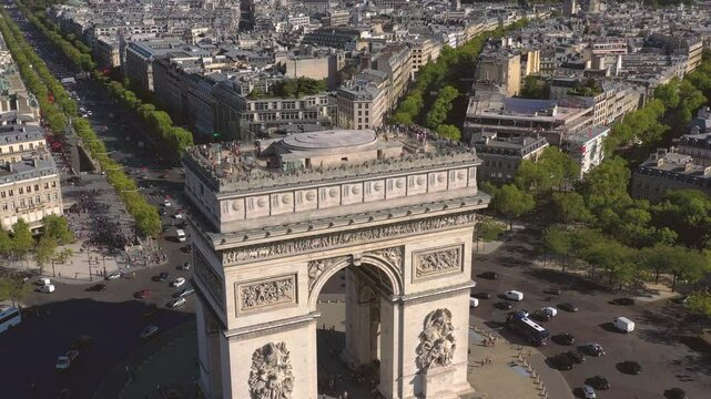 PARIS, FRANCE - OCTOBER 3, 2024: Stunning aerial view of Arc de Triomphe, bustling streets and vibrant trees surrounding the landmark