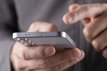 Close up of a man using mobile smart phone