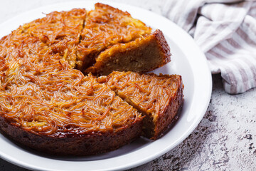 Traditional kugel - casserole from caramelized sweet noodles.