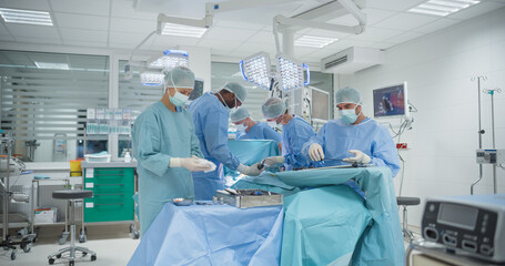 Wearing Sterile Gear in Operating Room, Multicultural Male and Female Surgical Team Collaborates with Steady Hands and Intense Focus, Executing a Surgery to Save Their Patient's Life