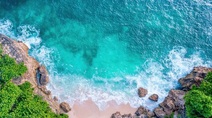 Aerial View of Pristine Tropical Beach with Clear Turquoise Water, Rocky Shoreline, and Lush Greenery in a Serene Coastal Setting