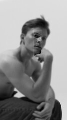 Contemporary art collage. Male gaze with sharp focus, radiating clarity and strength. Black and...