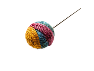a ball of yarn on a needle
