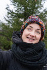 Portrait of young girl with braces outdoor at winter
