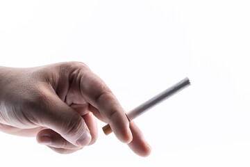 A person holding a cigarette in their hand - no smoking concept.