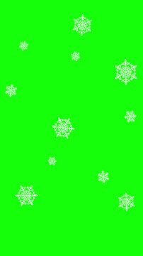Snow flakes falling over green screen chroma key  background. Christmas happy new year holiday 4K animation. Seamless loop. 