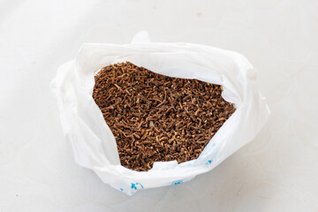 Dried folded earbuds in a bag