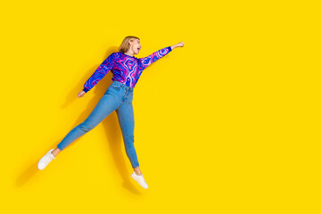 Full length photo of lovely young lady flying superman motivation dressed stylish colorful blue...