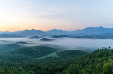 Fototapeta premium Misty Mountain Sunrise Panorama: A Breathtaking View of Nature's Majesty