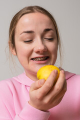 Girl with braces eat apple fruit