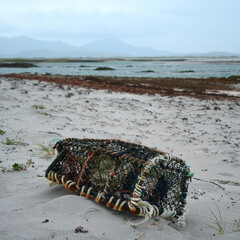 An old crab creel on the seashore. Isle of Harris, Scotland