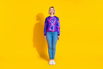Fototapeta premium Full size photo of pretty young girl model black friday shopping wear trendy colorful blue outfit isolated on yellow color background