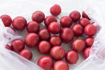 Fresh purple leaf red plum fruit