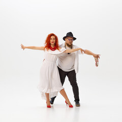 Energy of Latin dance. Salsa duo practices with intensity, perfecting their moves and rhythm...