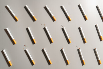 World no tobacco day concept template. Flat layout of cigarettes or tobacco on gray background.