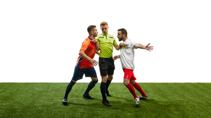 Referee standing between two players from opposing teams who are arguing, illustrating conflict resolution during soccer game. Concept of sport, fair play, competition, control, rules