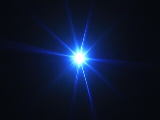 Fototapeta premium Bright blue light is shining on a dark background. The light is so bright that it almost looks like a star