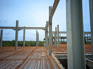 photo of steel building columns with wire mesh floors