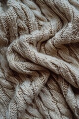 Fototapeta premium Knitted sweater with a lot of texture and a fuzzy appearance. The sweater is made of wool and has a warm, cozy feel