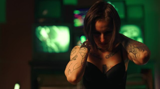 Self-harm and drug addiction, portrait of woman with tattoos and piercings. Young lady with big black eyes scratching her head and body, hurting yourself and self-destructive behavior, drug addiction