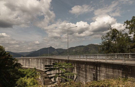 View of Khun Dan Prakan Chon Dam was formerly named Khlong Tha Dan Dam. is the longest concrete - crushed construction in the world (RCC) with sky and clouds in the background at Nakhon Nayok.