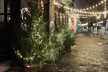 Fototapeta premium New Year's decorations on the street for pedestrians in the city at night
