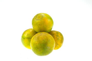 Four oranges stacked on a white background.