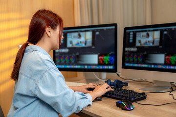 A young woman editing videos at home